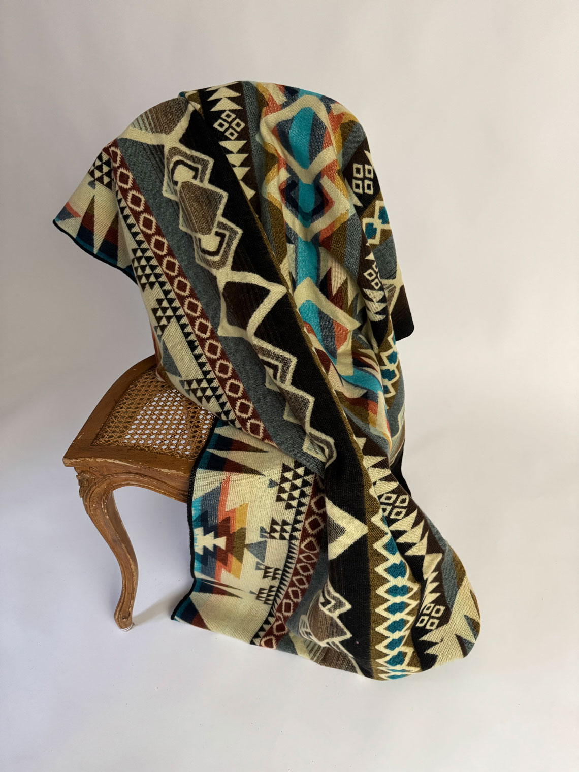 Handcrafted alpaca blanket from Enchanted Farms Boutique, naturally soft and hypoallergenic.